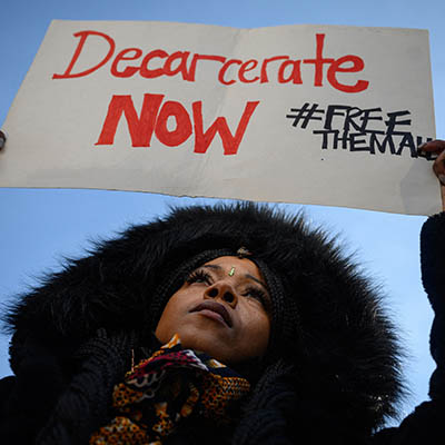 Person holds sign